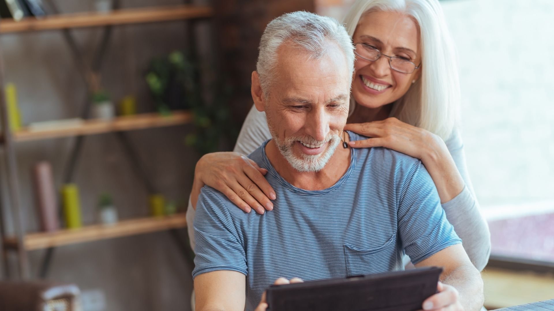 older couple looking at their checklist for making a will