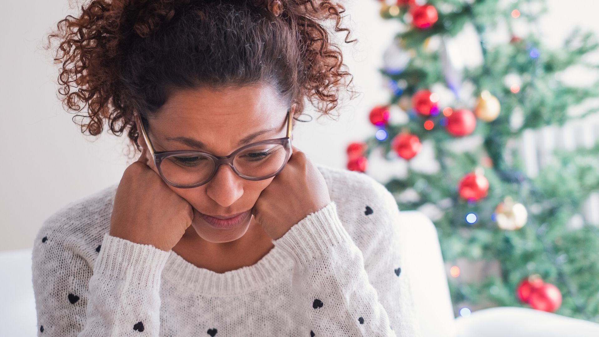 woman looking stressed on Christmas day