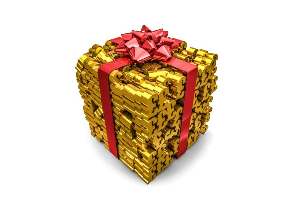 Lots of gold pound signs stacked into a cube with a red bow on top to represent a gift.